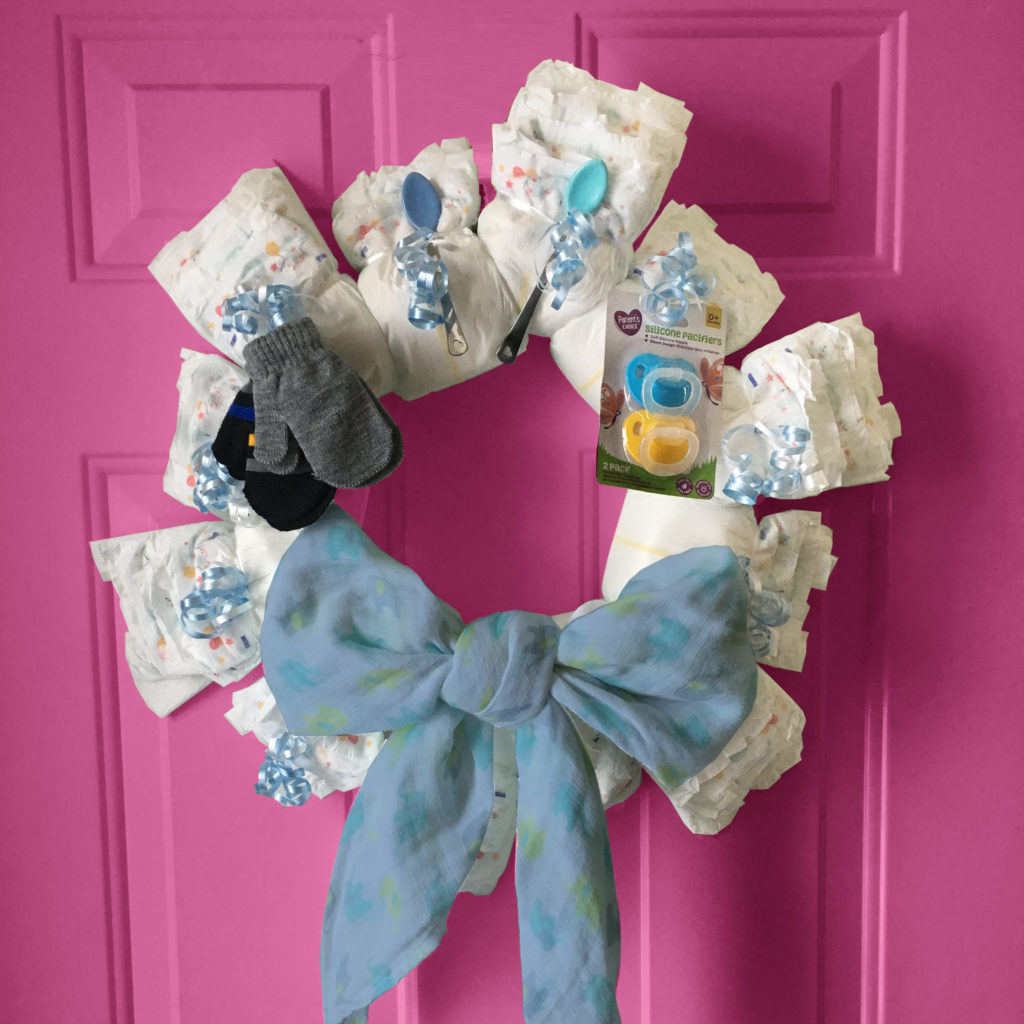 DIY diaper wreath on door